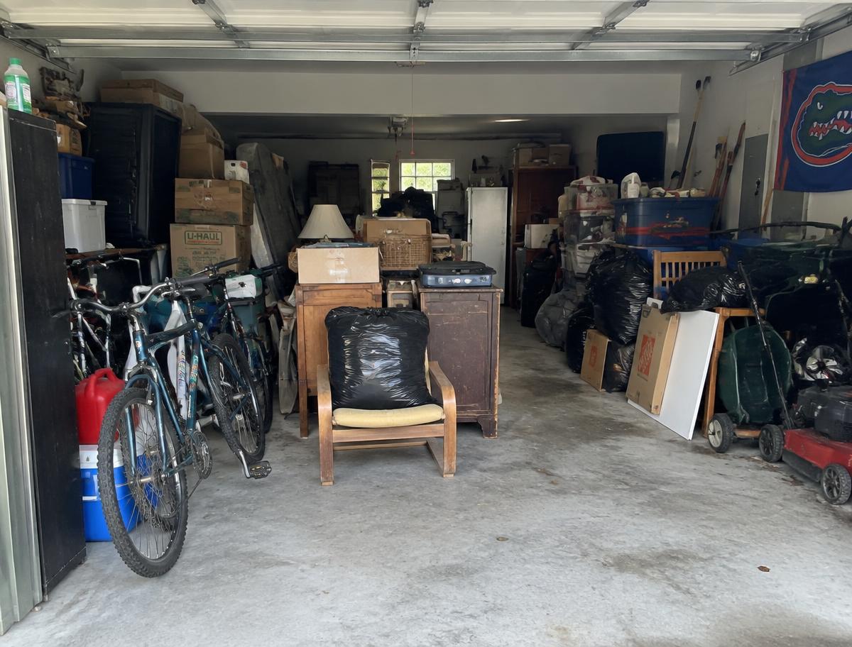 Cluttered garage cleared — before